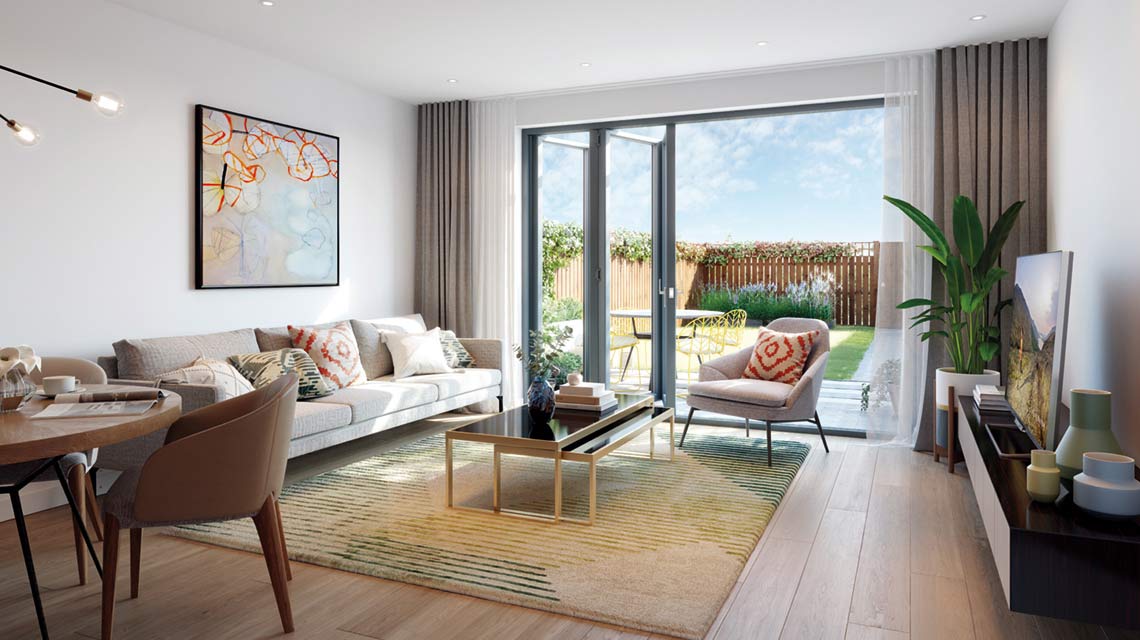 Modern living room with a beige sofa, coffee table, TV, and artwork on the wall. Large glass doors open to a patio and garden with a wooden fence, allowing natural light inside.
